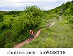 A couple riding their mountain bikes on single track trail in Ontario, Canada
