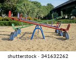 Small photo of old seesaw or teeter-totter in kids playground