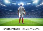 Football player with ball in the stadium, 3d rendering