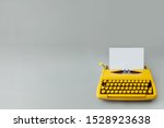 Retro Typewriter On A Grey...