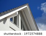 modern house building with windows against blue sky
