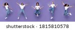 Five Multiracial Women Jumping Posing In Mid-Air Having Fun Over Purple Background, Smiling To Camera. Different Poses Jump Concept. Panorama, Studio Shot, Full Length