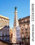 Small photo of The obelisk is a Baroque style work located in Piazza San Domenico Maggiore in Naples, a work begun by Cosimo Fanzago 1656 to avert the plague in the city, completed by Vaccaro 1737.