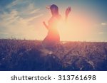 Young and handsome girl dancing outdoors at sunset