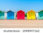 A Row Of Colorful Wooden Beach...