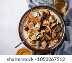 Small photo of Stir-frying Ginger and clams at high heat to bring forth the savory aroma with sesame oil in recipe