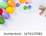 Small photo of Design concept - Preparing for Easter celebration, painting Easter eggs with colorful Acrylic pigment color dyestuff in palette, top view, lifestyle.