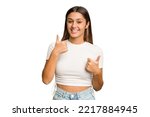 Young Indian woman isolated cutout removal background raising both thumbs up, smiling and confident.