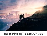 Small photo of Man climbing up mountain against city background. Reach your life goals and conquer your fears concept. Double exposure.