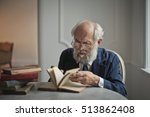 Historian Studying A Book