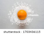 Orange and letter C on a yellow background. Concept of Vitamin C Doodle style icons image Flat lay Concept of protecting immunity during viral infection