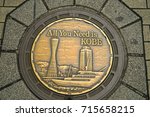 Small photo of KOBE, JAPAN - May 06, 2017 : A manhole cover in Kobe, Japan. Kobe tower at Port of Kebe embossed on a manhole cover as a symbol of an important city's landmark.