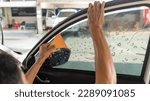 Small photo of Technician Installing car window tint. Car window tinting series. Car window tinting specialist install car film windscreen.