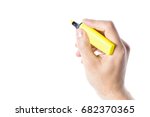 Hand with yellow highlighter isolated on white background