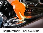 A man cleaning car with microfiber cloth. Car detailing. Selective focus. Car detailing. Cleaning with sponge. Worker cleaning. Microfiber and cleaning solution to clean. 