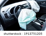 Airbag exploded at a car after the accident. Driver and Passenger AirBag. Car crash. Interior of a car after crash. Inside Automobile
