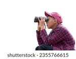 Asian boy holding binoculars isolated on white background with clipping path, concept for birdwatching, fishwatching, animalwatching, insectwatching, trekking, travelling and nature study of children.