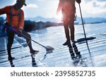 Small photo of Photoelectric technicians washing and cleaning the upper surface of solar rooftop of the building to increase power efficiency of solar panel system, soft focus, new edited.