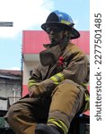 Small photo of Davao City, Philippines - March 18, 2023: Fireman, 86th Araw ng Dabaw Celebration