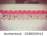 test tubes with assays. blood... | Shutterstock . vector #1038333412