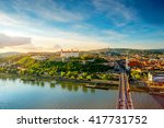 Bratislava aerial cityscape view on the old town with Saint Martin's cathedral, castle hill and Danube river on the sunset in Slovakia. Wide angle view with copy space