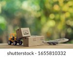 Small photo of Logistic and cargo freight concept: Fork-lift truck moves a pallet with Paper boxes, plane. depicts delivery management from the point of origin to point of consumption according to needs of customers