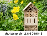 An insect hotel or bee hotel in ...