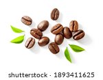Coffee beans with green leaves isolated on white background , top view , flat lay.