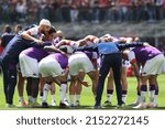 Small photo of Italy, Milan, may 1 2022: Fiorentina's starting line up incite each other during warm up about warm up about football match AC MILAN vs FIORENTINA, Serie A 2021-2022 day35 San Siro stadium