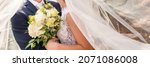 Small photo of Cropped shot of an affectionate young newlywed couple embracing eachother on their wedding day. Just married husband and wife panoramic banner. Wedding and love concept.