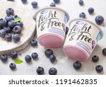 Small photo of LONDON, UK - SEPTEMBER 26, 2018: Light and Free greek style yogurt with blueberries by Danone with berries