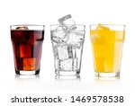 Glasses of cola and orange soda drink and lemonade sparkling water on white background with ice cubes