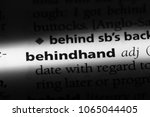 Small photo of behindhand word in a dictionary. behindhand concept.