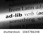 Small photo of ad-lib word in a dictionary. ad-lib concept.