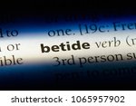Small photo of betide word in a dictionary. betide concept.