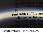 Small photo of heinous word in a dictionary. heinous concept.