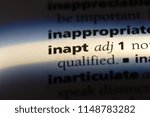 Small photo of inapt word in a dictionary. inapt concept.