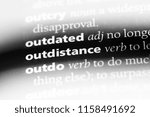 Small photo of outdistance word in a dictionary. outdistance concept.