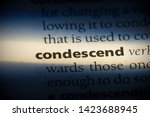 Small photo of condescend word in a dictionary. condescend concept.