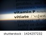 Small photo of vitiate word in a dictionary. vitiate concept, definition.