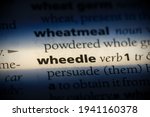 Small photo of wheedle word in a dictionary. wheedle concept, definition.