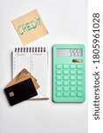 Small photo of calculater ,pen and blank notebook for office on white background isolated. credit cards