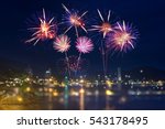 Colorful fireworks display over city on the beach.
Firework celebration sparkling in midnight sky, sea bokeh light at Patong beach, Phuket, Thailand