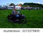 Small photo of 29th May 2022- A man riding his 1929 Triumph NSD motorcycle and sidecar at a classic vehicle show near Newcastle Emlyn, Ceredigion, Wales, UK.