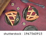 Slices of pie called 'Linzer Torte', a traditional Austrian shortcake pastry topped with fruit preserves and sliced nuts with lattice design