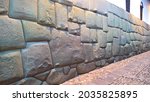 View to Twelve-angled stone aka Hatun Rumiyoc as a part of a wall of the palace of the Archbishop of Cuzco in Peru