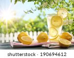Citrus lemonade in garden setting,summer drink.