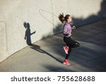 Fitness woman skipping with a...