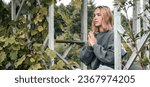 Small photo of meditation Woman meditates nature outdoor. ground level,relaxed woman meditates breathes fragrant incense during a yoga class garden,healthy living,slowing-down, deceleration, peace,wellness