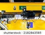 Small photo of Close up electric over head crane hoist with trolley frame drive unit wire rope hook block for lifting and transfer object and reduce work load